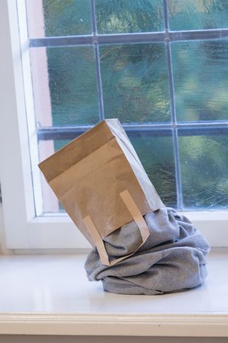 installation view Konzertsaal <i>Helldog</i>, 2009, bronze cast, fabric, paper bag, 36 x 31 x 20 cm