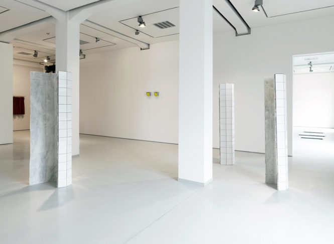 <i>3 Upright (second cycle 2013 – )</i>, <i>Balls</I> 2010. Oversized tennis balls, tiles, silicon. 19 x 62 x 15 cm