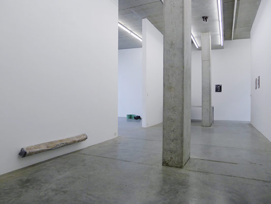 <i>Hunting Scene – Dusk</i>, 2010 rolled Persian motive silk carpet, plastic, metal-shelf 14 x 134 x 18 cm 2010 The rolled and wrapped carpet hovers approximately 16 cm above the floor. The carpet belonging to family Buck and sent to her by her Mother remains unrolled for over 16 years – its decorative scene and what she remembers of it exists as a personal narrative as much as it does an art historical and sculptural narrative.